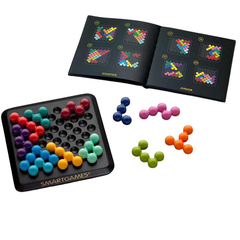 A board game set shown on a clean white background, including a black square game board with colorful round pieces, an open instruction booklet, and several loose pieces in red, blue, pink, green, orange, and yellow. The board is branded SMARTGAMES.