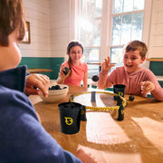 Picture of 3 kids playing the Spkepong game.  
