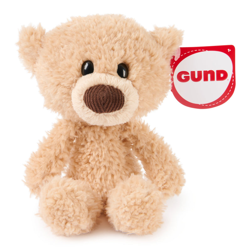 GUND Littles Toothpick tan plush bear seated beside its red GUND tag.