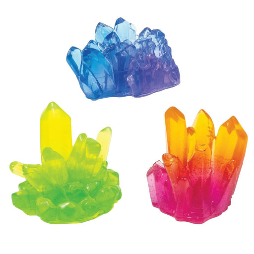 Set of colorful squishy crystal-like toys on a white background.