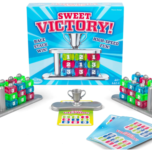 Sweet Victory board game set with colorful cubes and trophy against a white background.