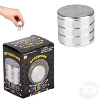 Silver metal gyroscope cylinder toy with hand demonstration and black retail packaging box