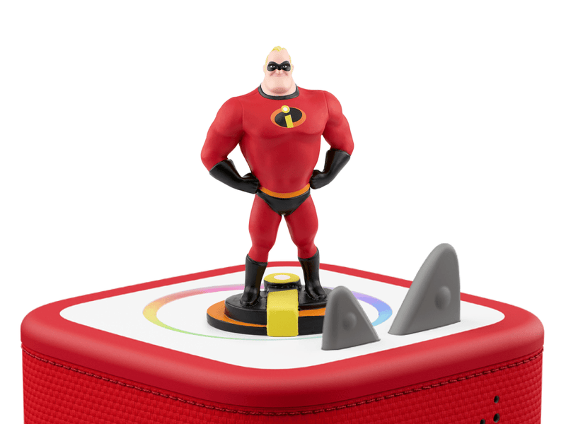 Mr. Incredible Tonie figure standing on red Toniebox speaker with gray accessories