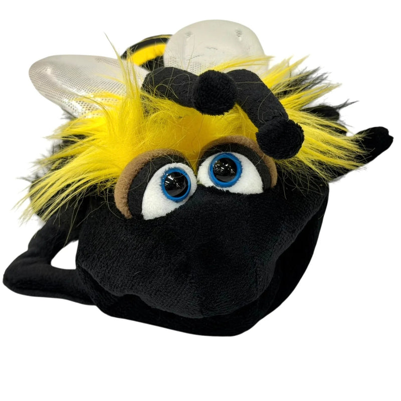 A plush bumblebee toy with black and yellow fuzzy body, large blue eyes, clear wings, and black antennae, photographed on a plain white background.