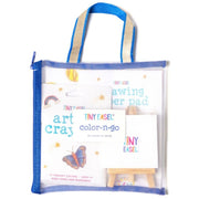 Art supplies set including a tote bag, coloring pad, and crayons on a white background