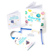 Artistic supplies including a coloring book, paper pad, and crayons on a white background