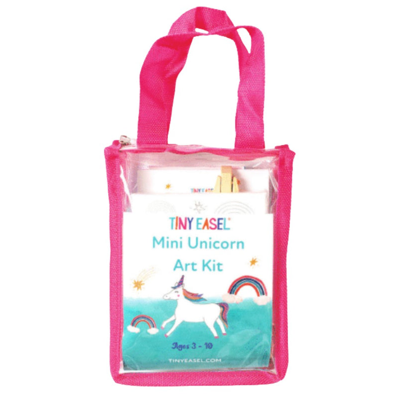 Clear tote bag with pink handle featuring a unicorn watercolor art kit with a picture of a unicorn and rainbow on the front. 