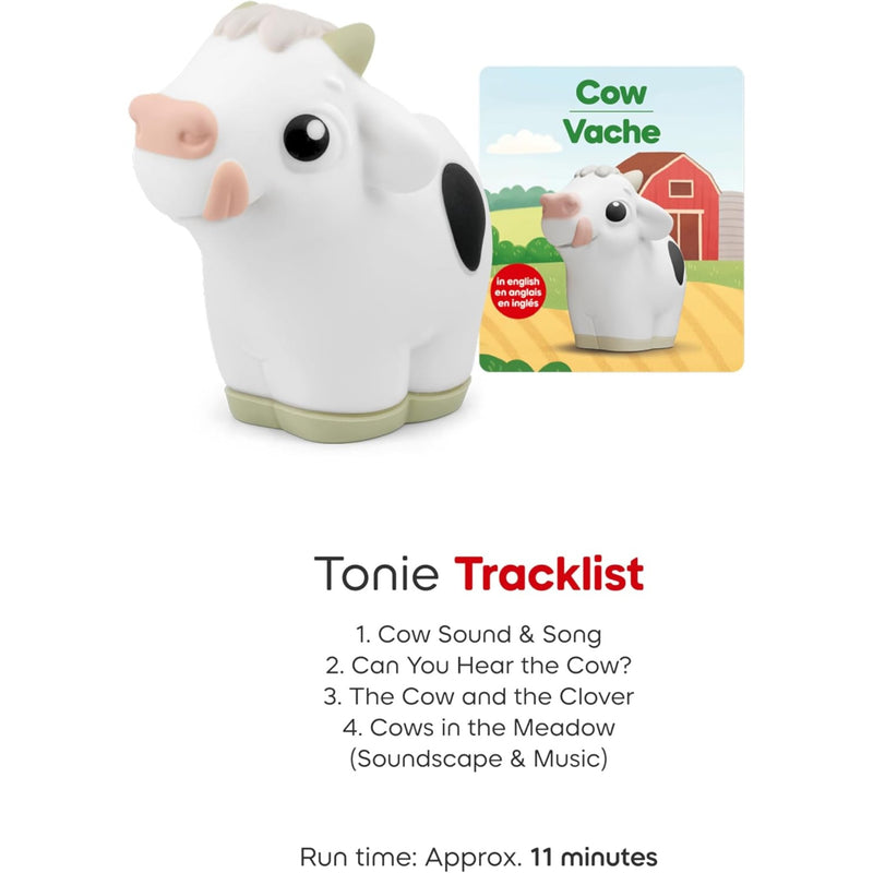 Tonie Cow with a white body, black spots, pink nose and ears, and light green hooves, shown next to its packaging insert. Below is a tracklist for the Tonie Cow music app.
