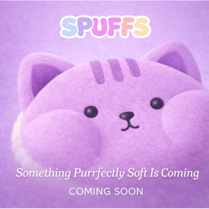A purple coming-soon graphic featuring a close-up of a soft plush cat face with the text 'SPUFFS' at the top and 'Something Purrfectly Soft Is Coming COMING SOON' at the bottom.