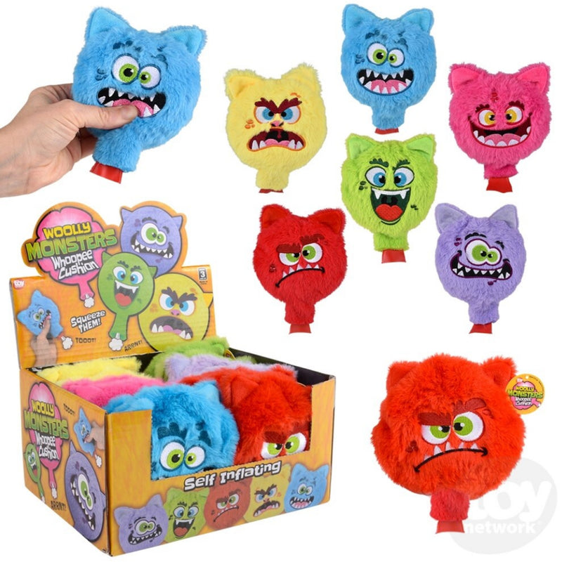 Plush Monster faces covering a whoopee cusion.  Multiple colors including blue, yellow, green, pink red and purple.  All are pictures on a white background.