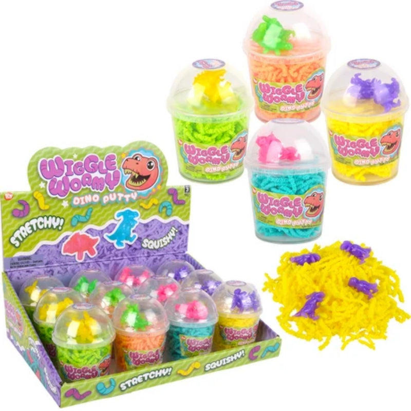 A display box and several clear plastic cups of Wiggle Worms Dino Putty in assorted bright colors, plus a pile of yellow putty with purple dinosaur pieces, on a white background.