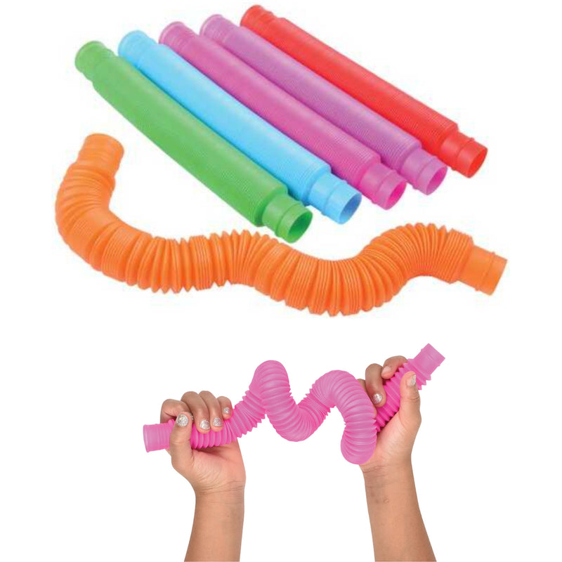 A set of colorful plastic pop tubes shown on a white background, including one orange tube bent into a loop, several tubes in green, blue, pink, and red stacked at the top, and a pair of hands holding a pink tube in a squished position to demonstrate flexibility.