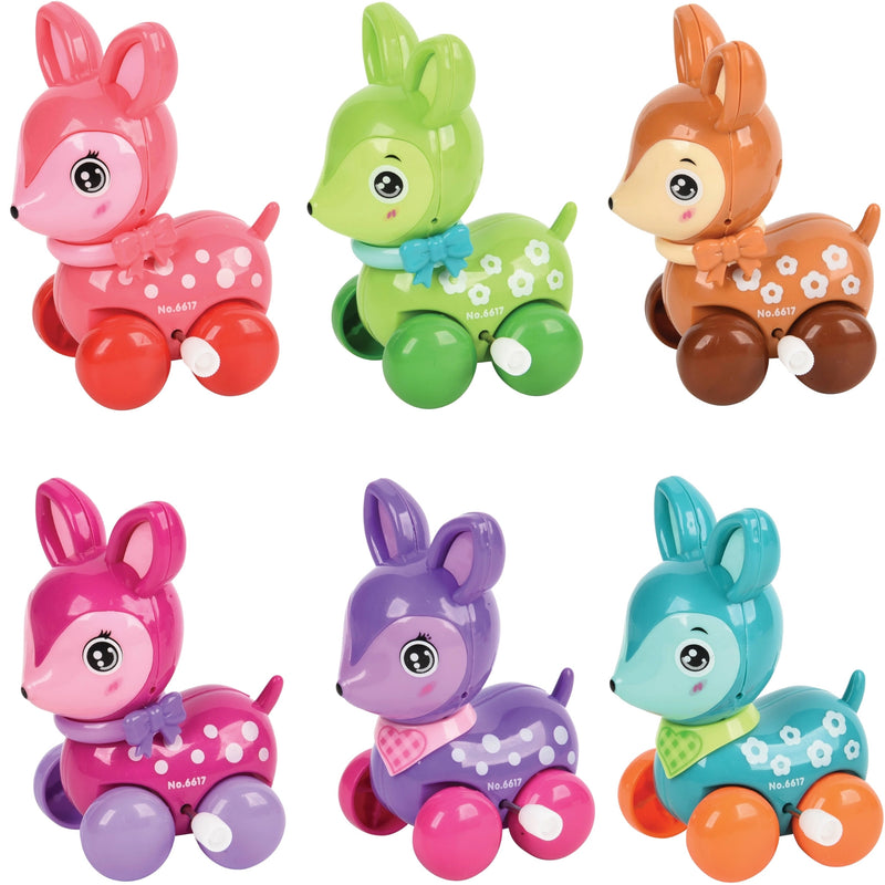 Six colorful plastic toy deer arranged in two rows on a plain white background. The toys come in pink, green, orange, purple, and blue, each with white polka dots and a small bow on their chests.