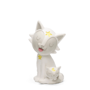 White Tonie figurine with star details and sleeping cat companion on green background