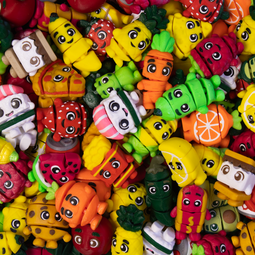 Assorted colorful 3D printed collectibles that look like popular food items -- french fries, carrots, hot dog, smores, strawberry and more.