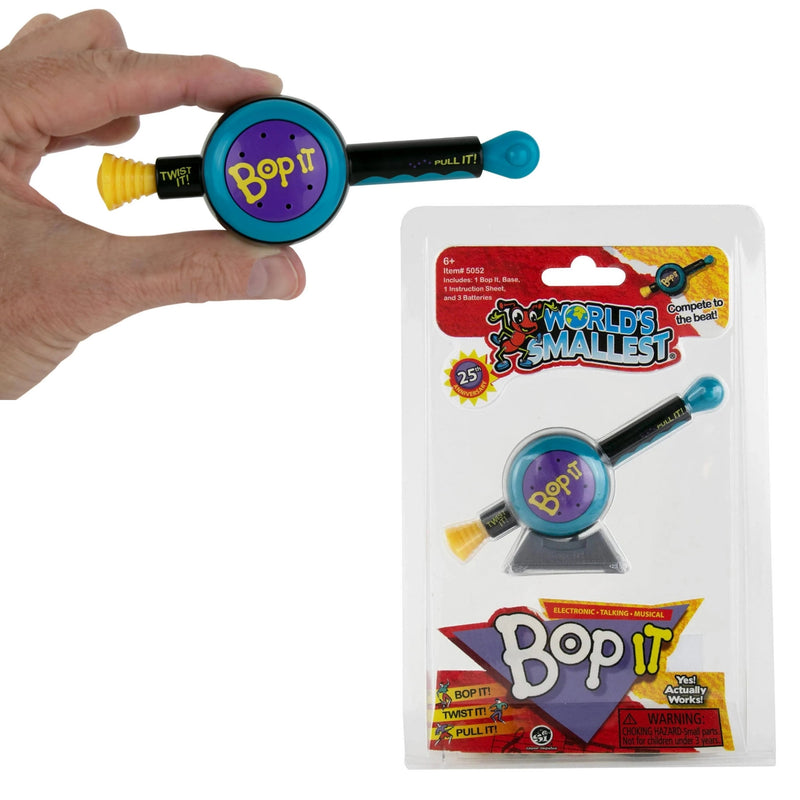 A hand holds a small toy called Bop It, which has a circular purple and blue top, a black handle, and a yellow twist mechanism. To the right is the product in its retail blister packaging, labeled 'The World's Smallest Bop It'.
