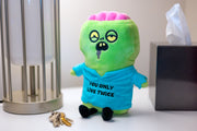 Green zombie plushie with pink brain and blue hoodie reading You Only Live Twice
