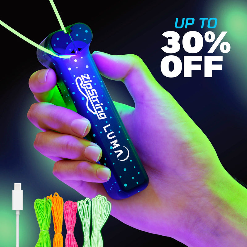 Hand holding blue ZipString Luma device with colorful LED lights and neon green cord