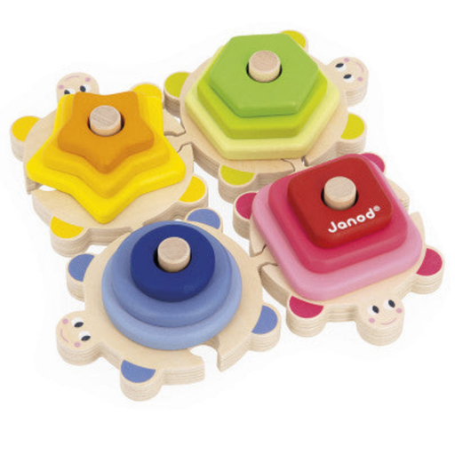 Four colorful wooden turtle-shaped stacking toys with geometric shapes on white background.