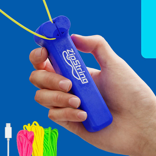 Hand holding blue ZipString device with colorful strings and charger.