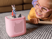 Child with pink Toniebox speaker featuring Judy Hopps character figure from Disney Zootopia