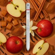 White Lifelines pen diffuser surrounded by apple slices, cinnamon sticks, and caramel pieces