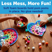 Children playing with colorful pom pom craft boards featuring rainbow and unicorn designs