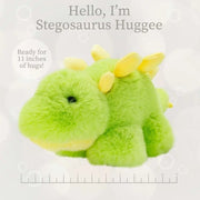 Green plush stegosaurus stuffed animal with yellow spikes and ruler showing 11 inch size