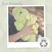 Green plush Stegosaurus toy being held by child with eco-friendly recycled stuffing branding