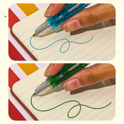 Hand using blue and green scented lava pens writing on lined notebook paper