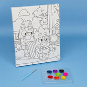 Bluey canvas paint kit with outline art, paintbrush, and colorful paint palette on blue background