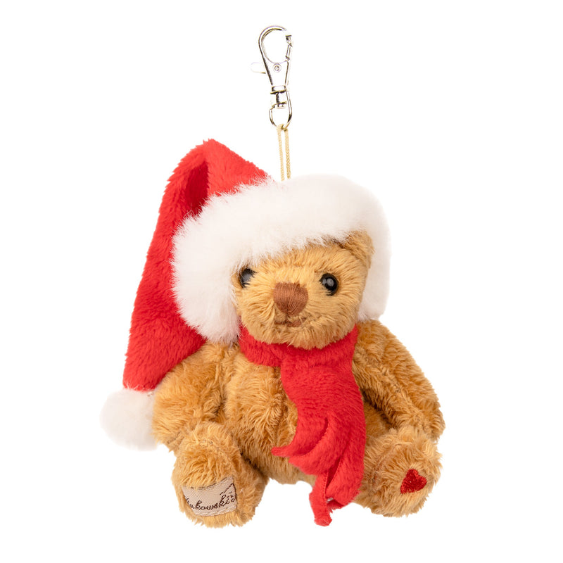 Brown teddy bear keychain wearing red Santa hat and scarf with gold clasp