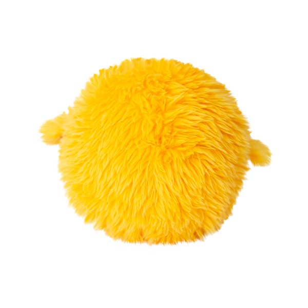Yellow fluffy round plush toy chick with small wings on white background