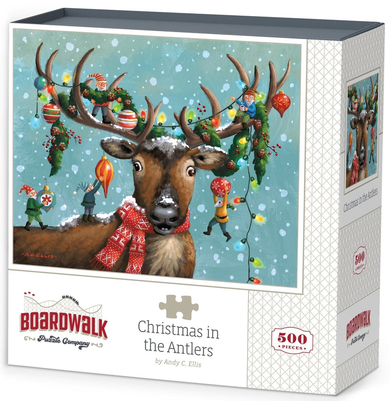 Boardwalk Puzzles Christmas In The Antlers 500-piece jigsaw puzzle box featuring whimsical reindeer artwork