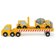 Yellow wooden construction transporter truck carrying cement mixer and crane vehicles