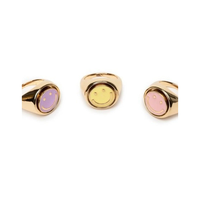 Three gold spinner rings with colorful smiley face designs on white background