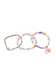 Three colorful beaded bracelets with rainbow theme including smiley face and rainbow charms