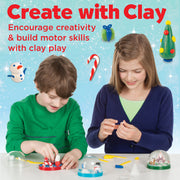 Two children making clay snow globes with holiday decorations and craft supplies
