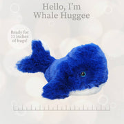Blue plush baby whale stuffed animal with measurement ruler showing 11 inch size