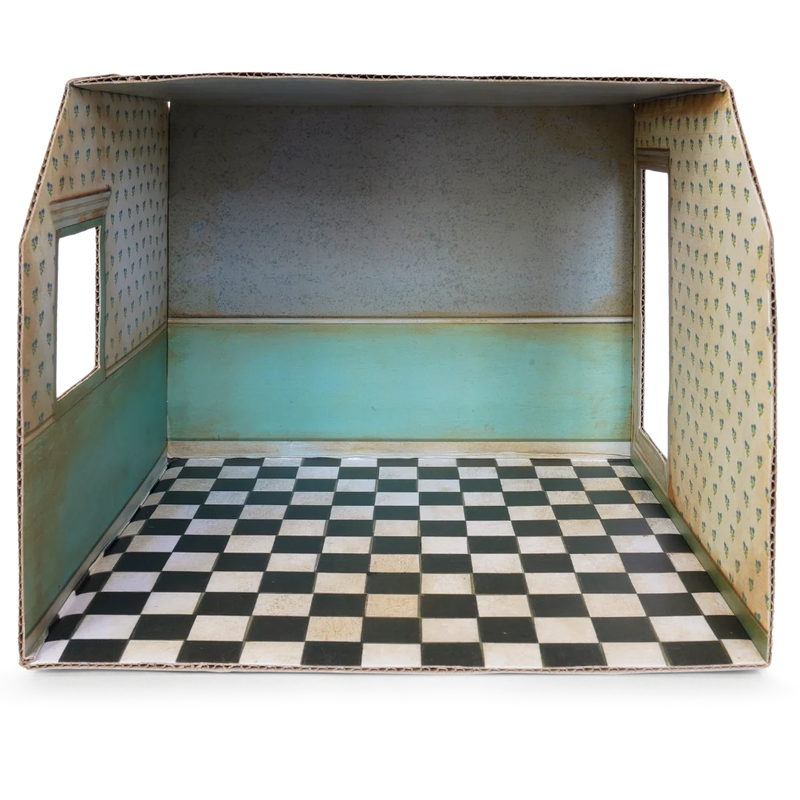 Cardboard dollhouse room interior with checkered floor and floral wallpaper