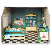 Cardboard dollhouse kitchen room with miniature furniture and accessories on checkered floor