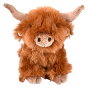 Fluffy brown Highland cow stuffed animal plush toy with long horns seated upright