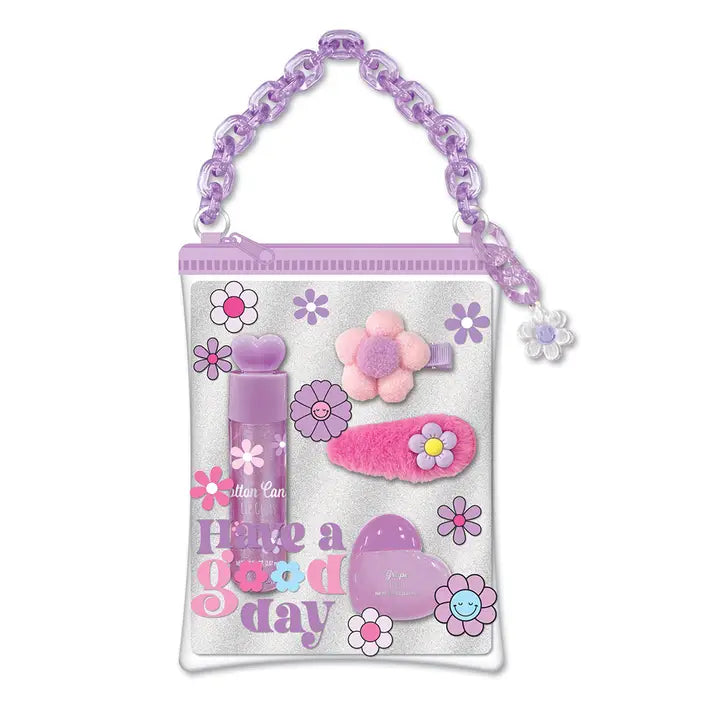 Purple beauty bag with chain handle containing nail polish, hair clips and flower decorations