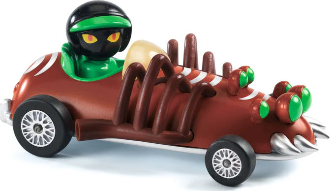Red spider-themed toy car with green alien driver and protruding brown spider legs