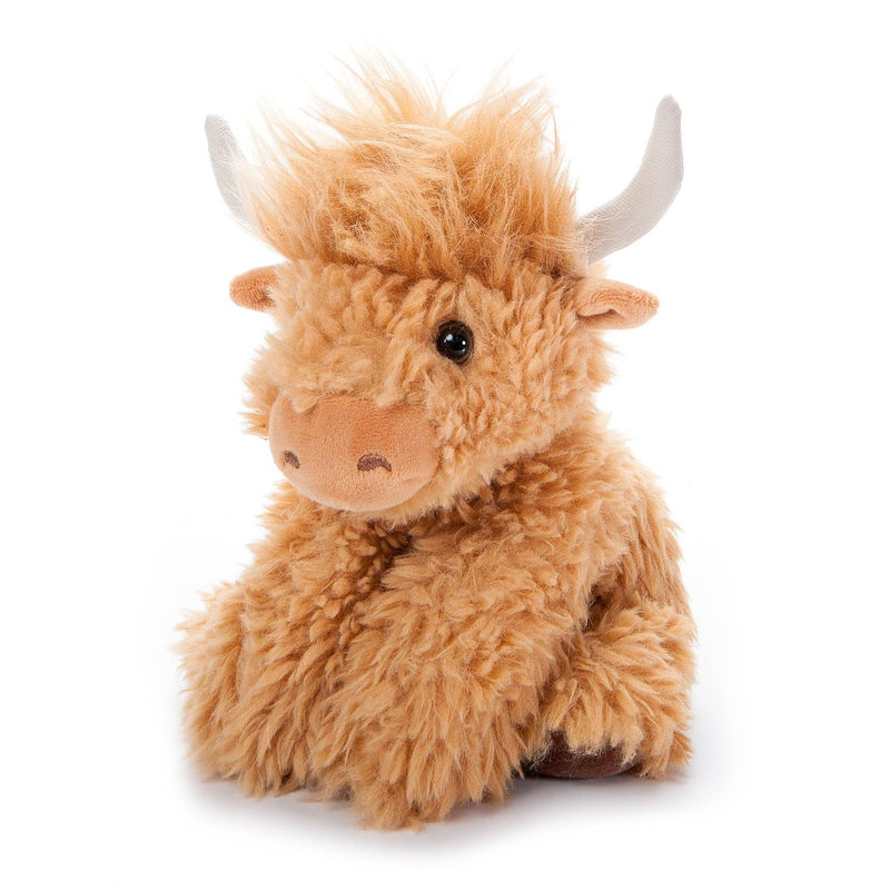 Miniature fluffy highland cow plush toy with curly golden brown fur and silver horns