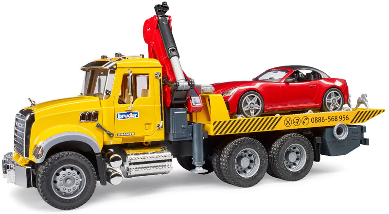 Bruder MACK Granite yellow tow truck with red roadster on flatbed platform
