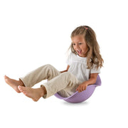 Child playing on purple Bilibo toy rocking and spinning seat