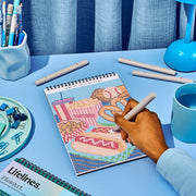 Person using FlowArt dot by letter coloring book with colorful dotted pattern design