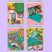 Four spiral-bound FlowArt Color-to-Reveal notebooks with vibrant citrus coastline illustrated covers