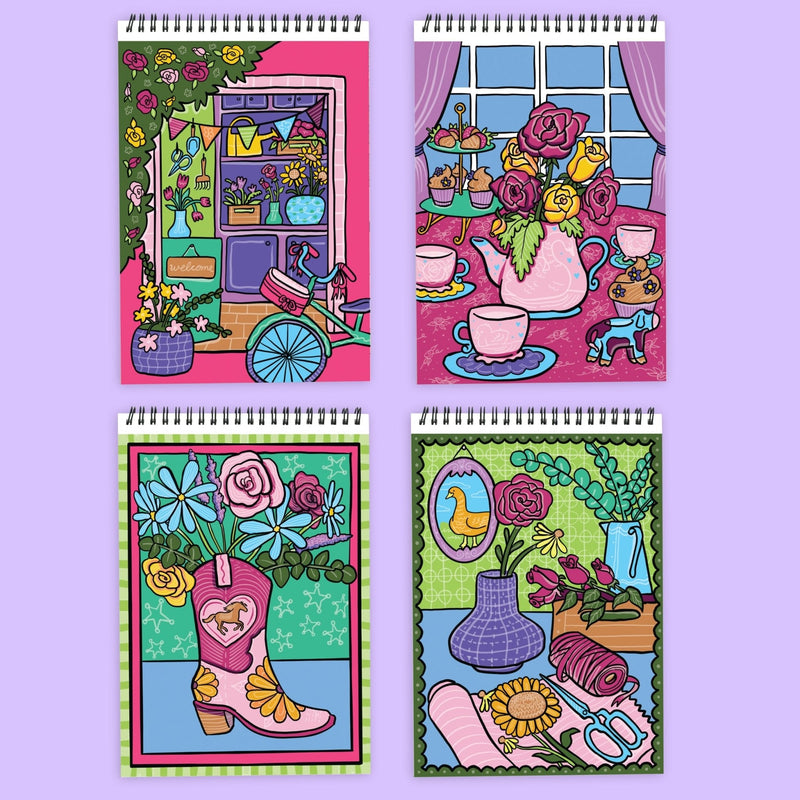 Four spiral-bound FlowArt coloring notebooks featuring vibrant floral illustration covers on lavender background